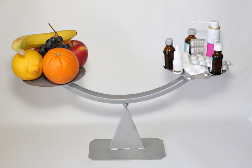 pictured are the scales on one side of the lay of the drugs on other fruits can replace drugs