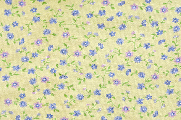 istock Yellow Fabric with Purple Flowers 467267994