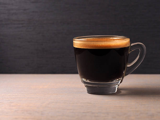 istock Cup of hot espresso coffee on wood board 467270522