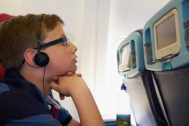 istock Teenager on a plane 467271090