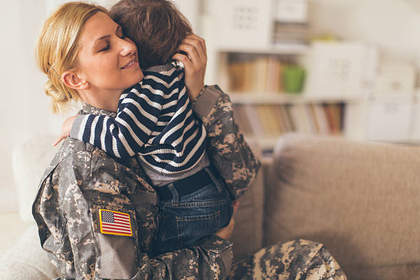 istock Woman soldier hugging her son 467271552