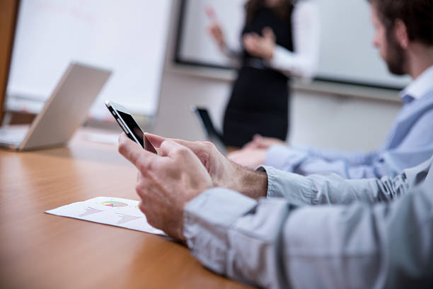 istock Businessman Surfing the Net During Meeting 467271560