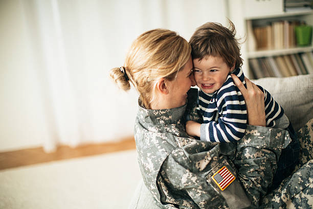 istock Safe in mommy soldier's hug 467271562