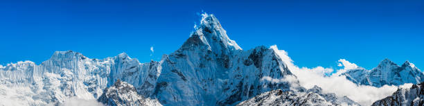 istock Jagged snowy mountain peaks panorama soaring above clouds Himalayas Nepal 467271790