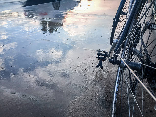 istock Wet Street with bycicle reflection 467274638