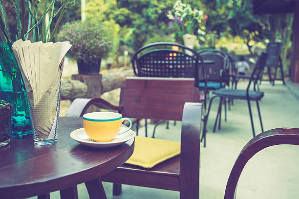istock Coffee cup on table in cafe with vintage color tone 467274944