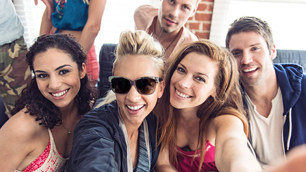 istock Group of friends taking selfie 467275228