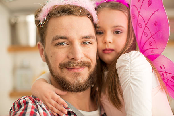 istock Father and daughter in kitchen taking selfies. 467283146