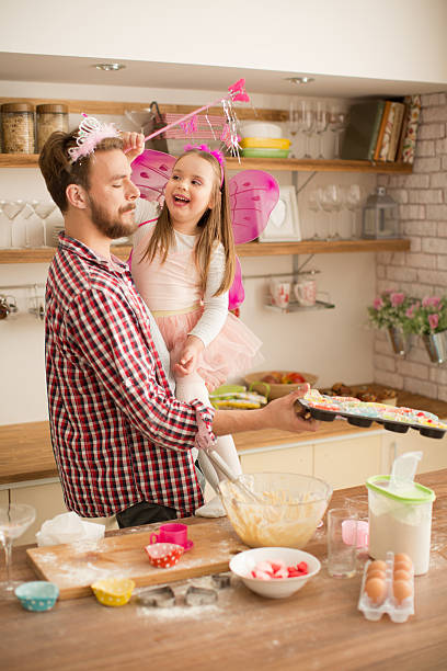 istock Father and daughter baking in kitchen. 467283186