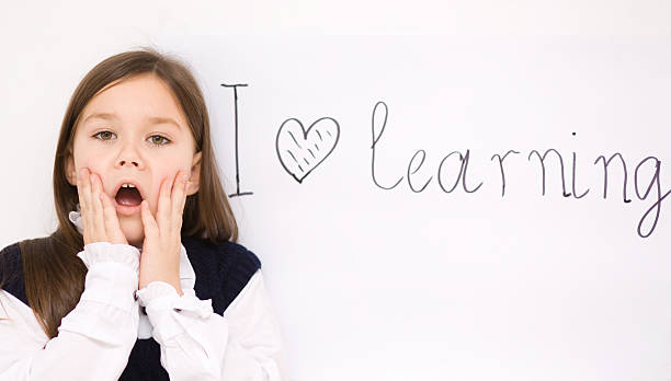 istock Cute girl is holding book 467286093