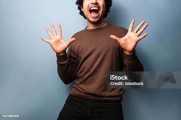 Young Man Is Very Excited Stock Photo - Download Image Now - Adult, Adults Only, Asian and Indian Ethnicities