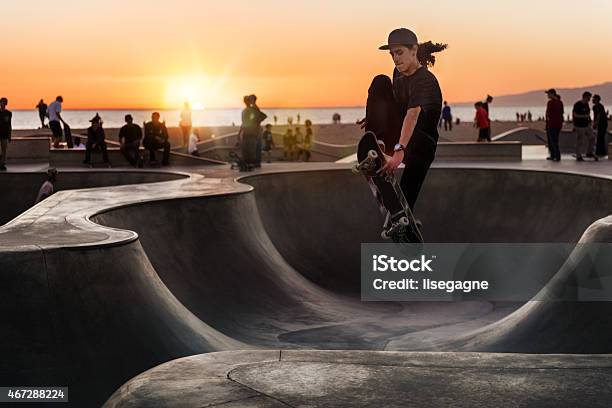 Skateboarding At Sunset Stock Photo - Download Image Now - Skateboarding, Skateboard Park, Sports Ramp