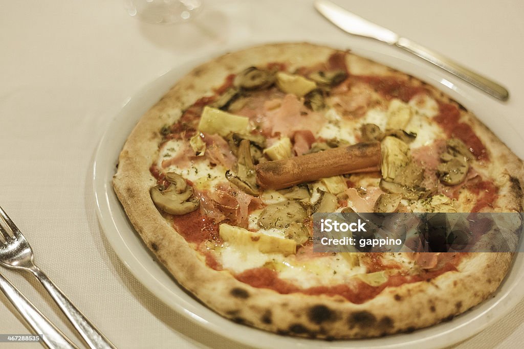 capricious pizza a capricious pizza photographed with window light. Baked Stock Photo