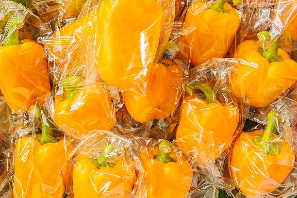 istock Bunch of plastic wrapped bell peppers 467289372
