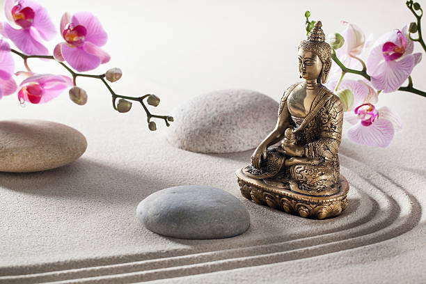 istock a bronze Buddha with sand and stones, for meditation and religion 467292475