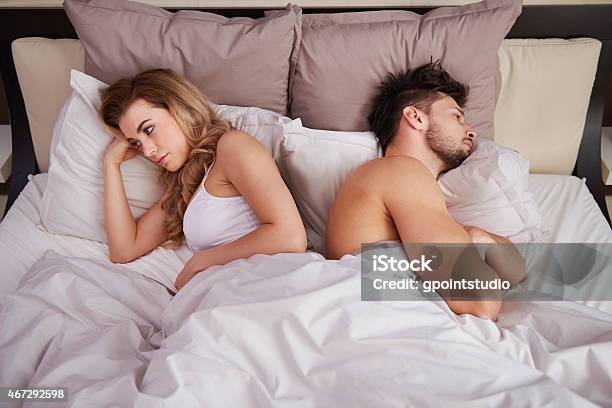 Frustrated Couple With Serious Problems Stock Photo - Download Image Now - Couple - Relationship, Bed - Furniture, Sulking