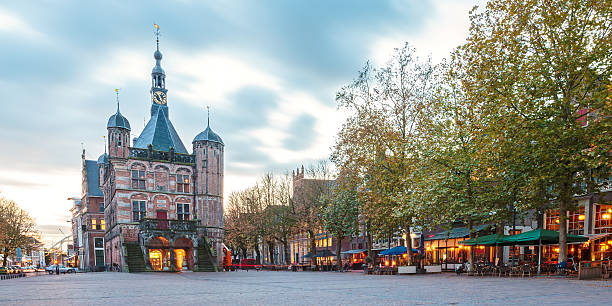The central square in the Dutch city Deventer Panoramic evening view of the central square in the historic Dutch city Deventer deventer photos stock pictures, royalty-free photos & images