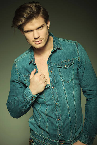 istock fashion man pulling his shirt 467293520