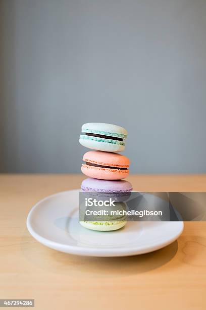 Macaroons Balancing On A Plate Stock Photo - Download Image Now - 2015, Baked, Balance