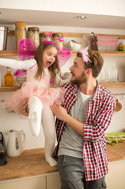 istock Father and daughter playing in kitchen. 467294778