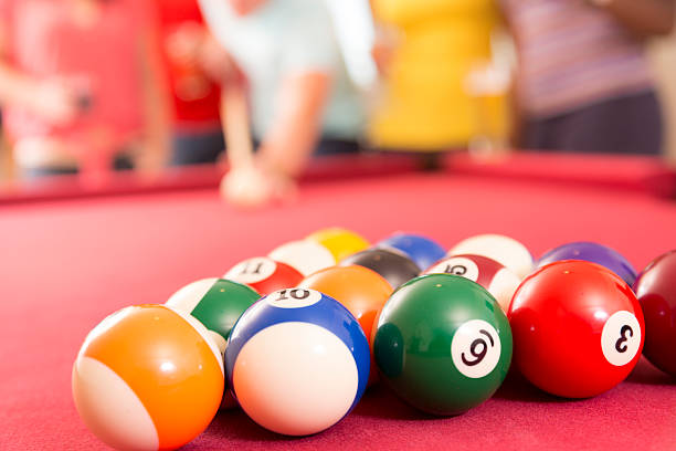 Close-up of a woman playing pool in a pool hall