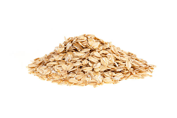 Pile of bran oat flakes with white background stock photo