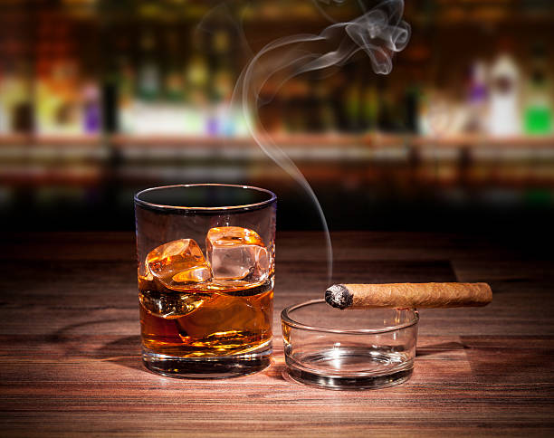 istock A glass with a drink and ice cubes and a cigarette 467298137