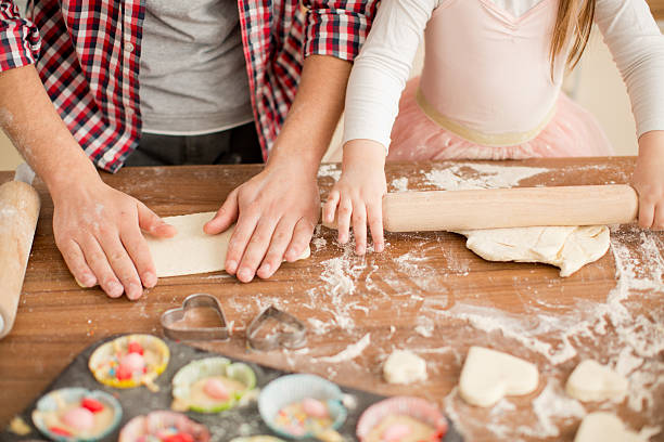 istock Father and daughter baking in kitchen. 467298500