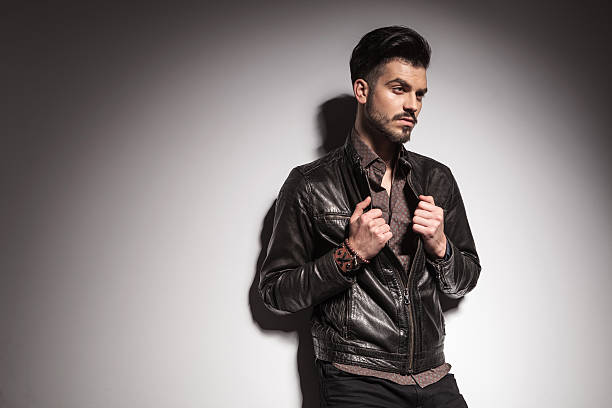 istock young fashion man fixing his jacket 467298620