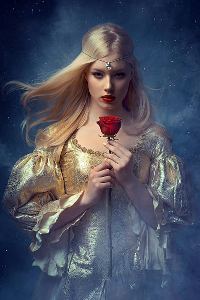 Beautiful woman Beautiful woman holding a red rose. Medieval style. queen royal person photos stock pictures, royalty-free photos & images