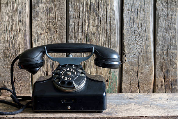 istock Old retro telephone on vintage boards 467299238
