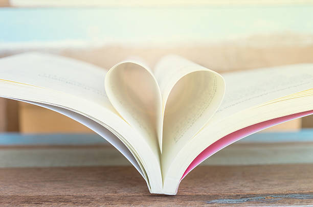 istock Heart shaped padlock with key and Heart book 467299686