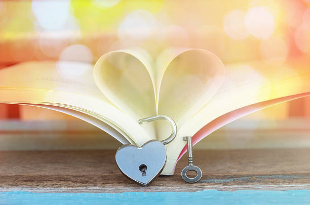 istock Heart shaped padlock with key and Heart book 467299698