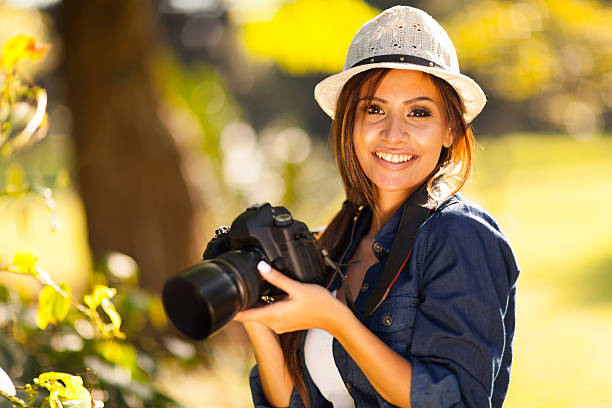 istock beautiful female student photographer with camera 467300941