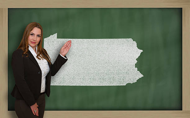 istock Teacher showing map of pennsylvania on blackboard 467301914