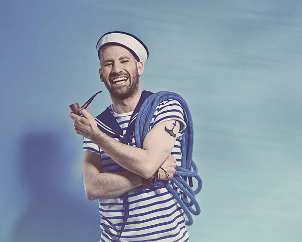 happy bearded sailor man holding pipe and rope - matros bildbanksfoton och bilder