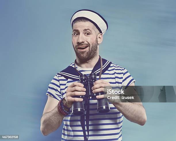Bearded Man In Sailor Style Outfit Holding Binoculars Stock Photo - Download Image Now