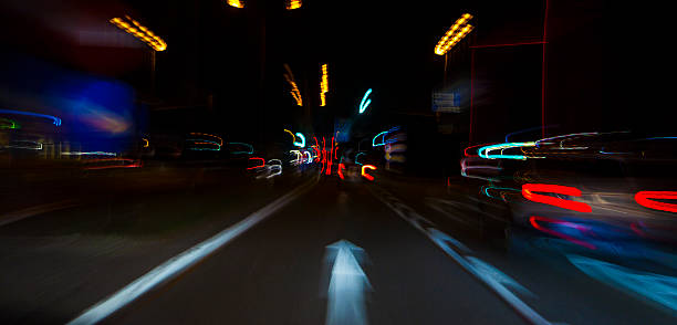 istock car lights on highway by night,abstract light trace background 467302680