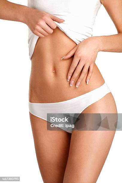 Close Up Of A Young Woman Showing Very Flat Belly Stock Photo