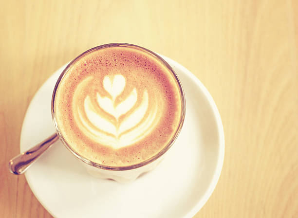 istock Cup of latte or cappuccino coffee with retro filter effect 467305187