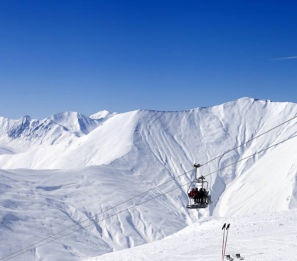istock Skiers on ropeway at ski resort Gudauri 467305797