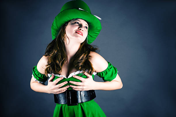 istock woman dressed as leprechaun 467305909