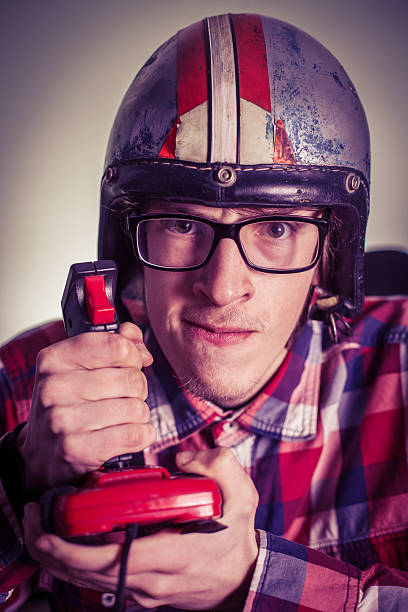 istock A young nerd playing video games on a retro joystick 467306776