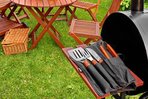 Close up of BBQ utensils at a garden party stock photo