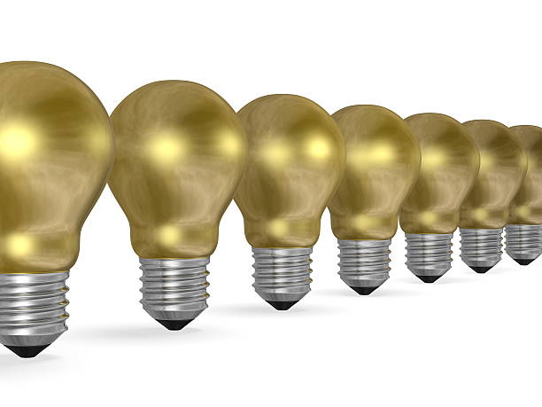 istock Row of golden light bulbs in perspective 467310219
