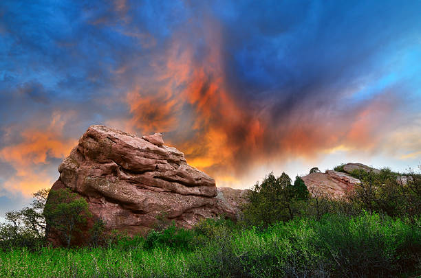 Sky on fire Sunset picture of a Red Rock in South Valley Park Colorado. littleton colorado stock pictures, royalty-free photos & images