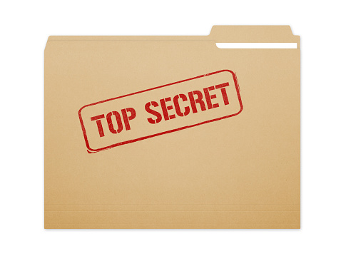 Top secret brown folder file with paper showing with a lot of copy space. Isolated on a white background with clipping path.