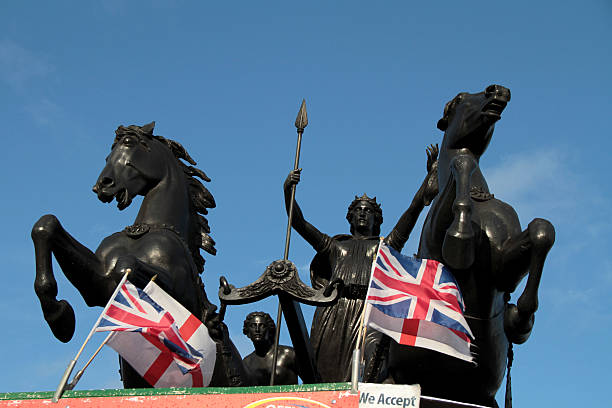 London, UK - December 04, 2016: Statue of woman and lion at the the circle outside Buckingham Palace in  London