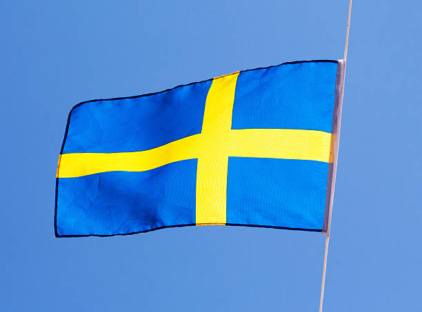 istock Swedish flag in wind against the sky 467314841