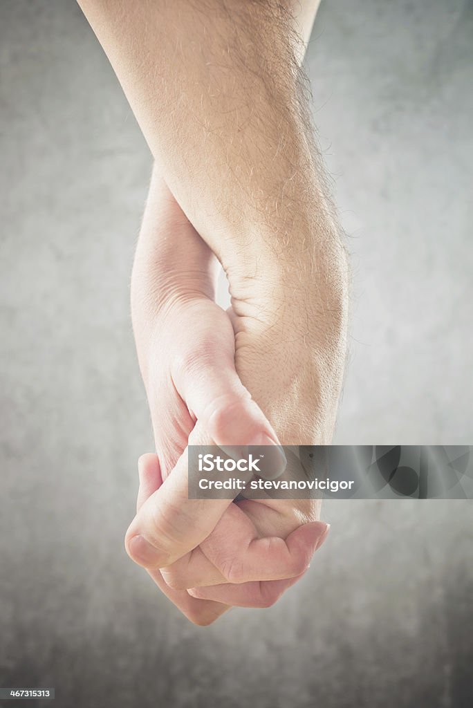 Couple holding hands Couple holding hands. Man and woman holding hands, cose up. Adult Stock Photo